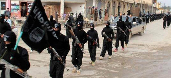 FILE - This undated file image posted on a militant website on Tuesday, Jan. 14, 2014, which has been verified and is consistent with other AP reporting, shows fighters from the al-Qaida linked Islamic State of Iraq and the Levant (ISIL) marching in Raqqa, Syria. Across the broad swath of territory it controls from northern Syria through northern and western Iraq, the extremist group known as the Islamic State has proven to be highly organized governors. (AP Photo/Militant Website, File)